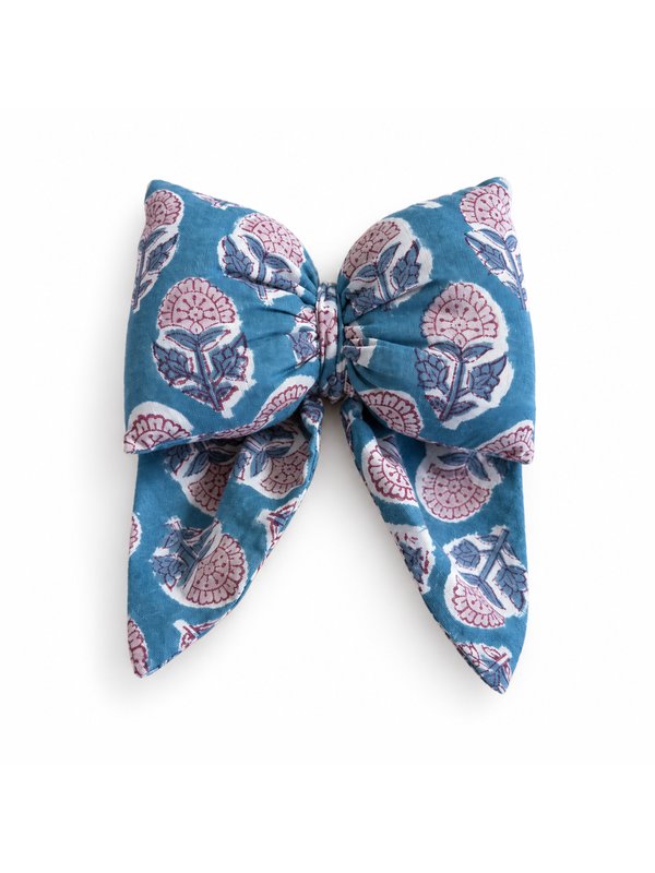 Teal Blossom bow, top-down on white