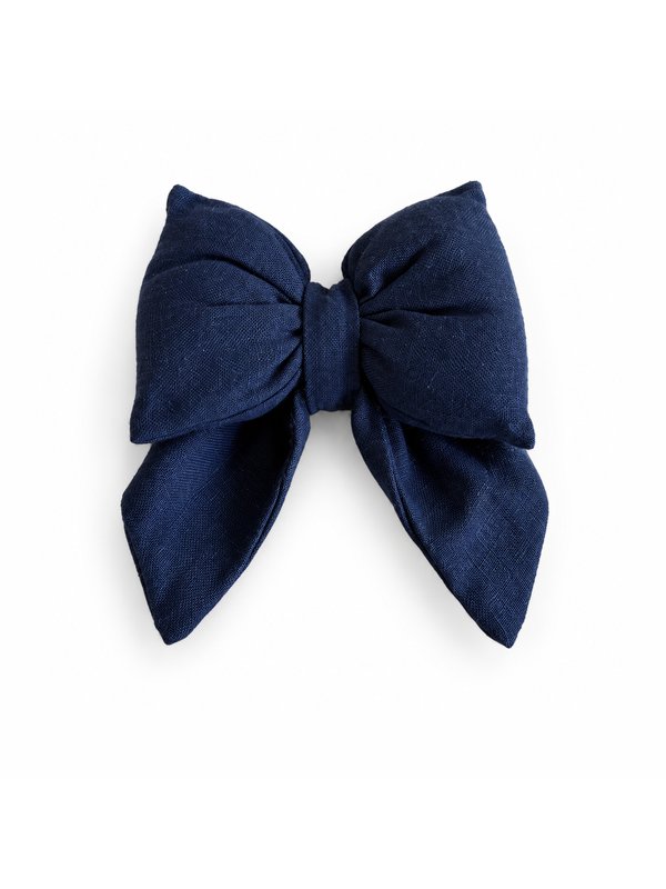 Solid Navy bow, top-down on white