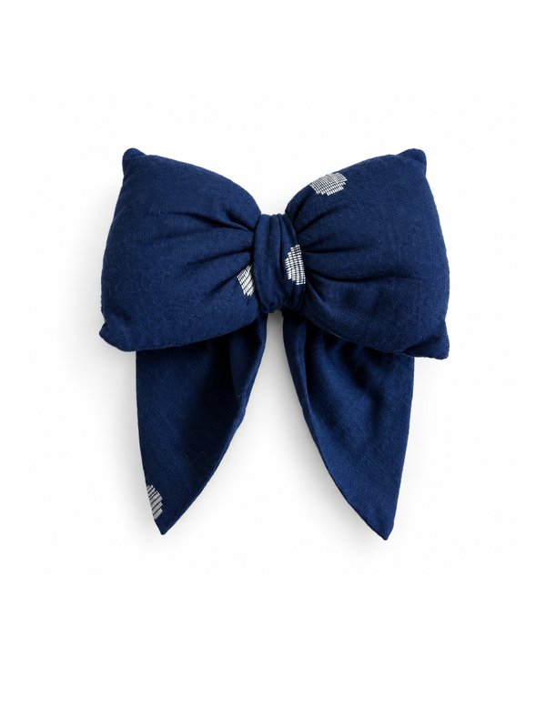 Navy Dot bow, top-down on white