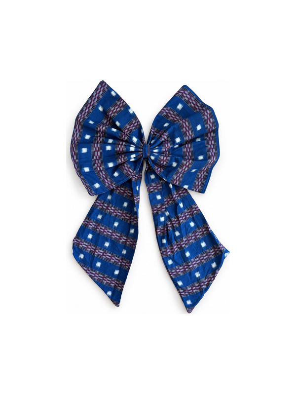 Neela Bow in indigo with white dots, top-down on white
