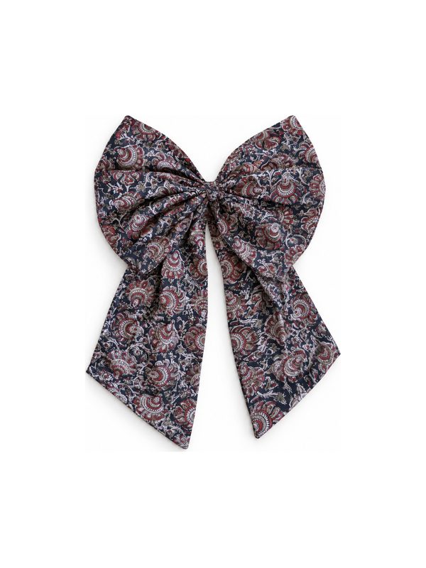 Neela Bow in dark paisley, top-down on white